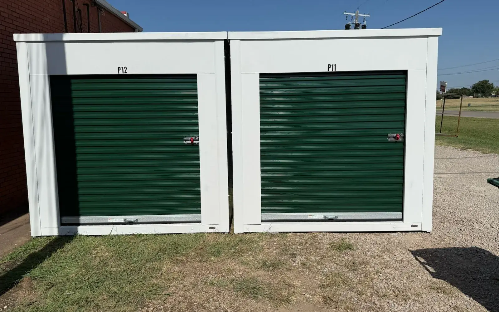 New outdoor drive-up container units with green roll-up doors